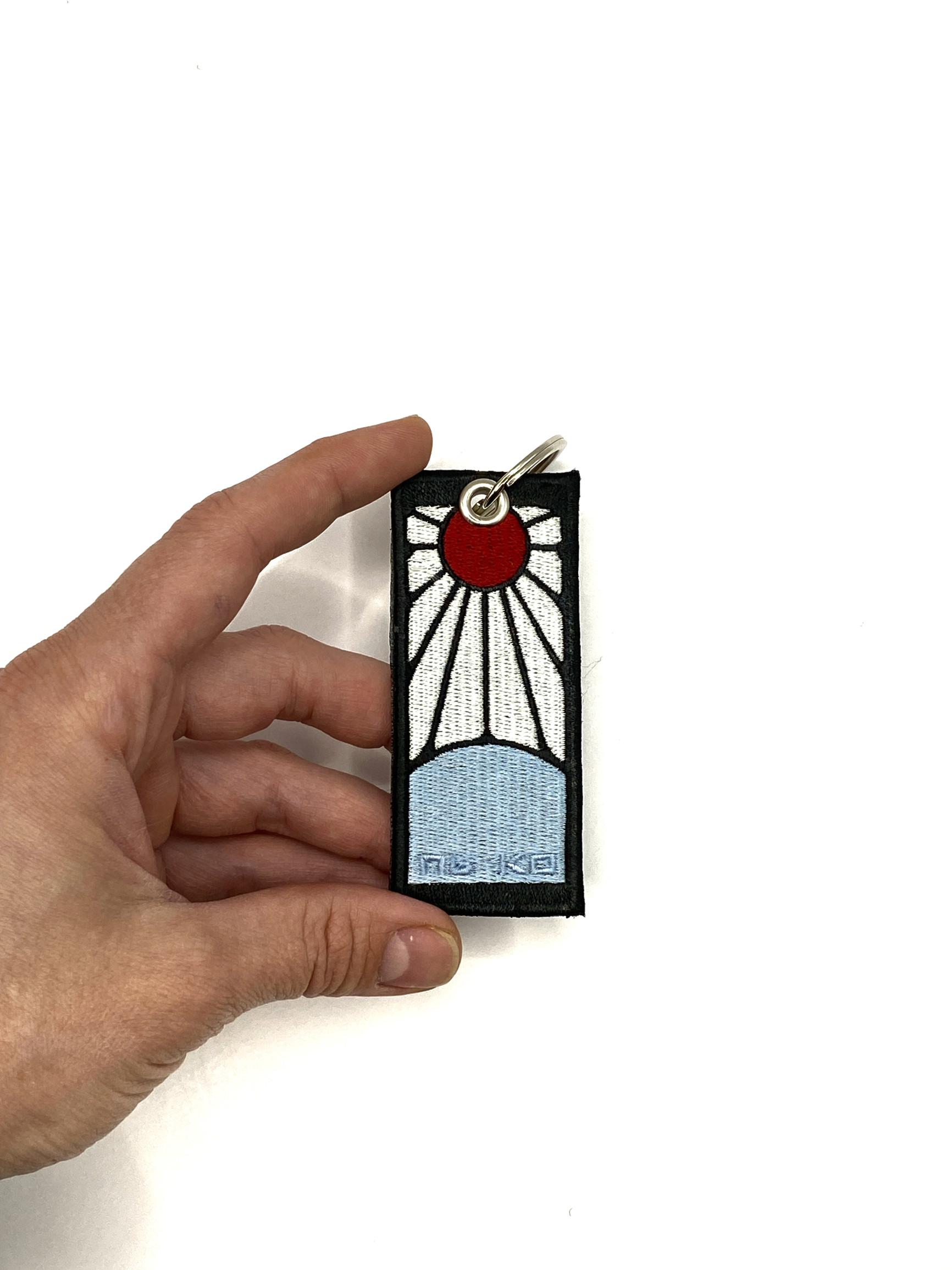 Брелок Серги Танджиро, аніме "Клинок який знищує демонів"